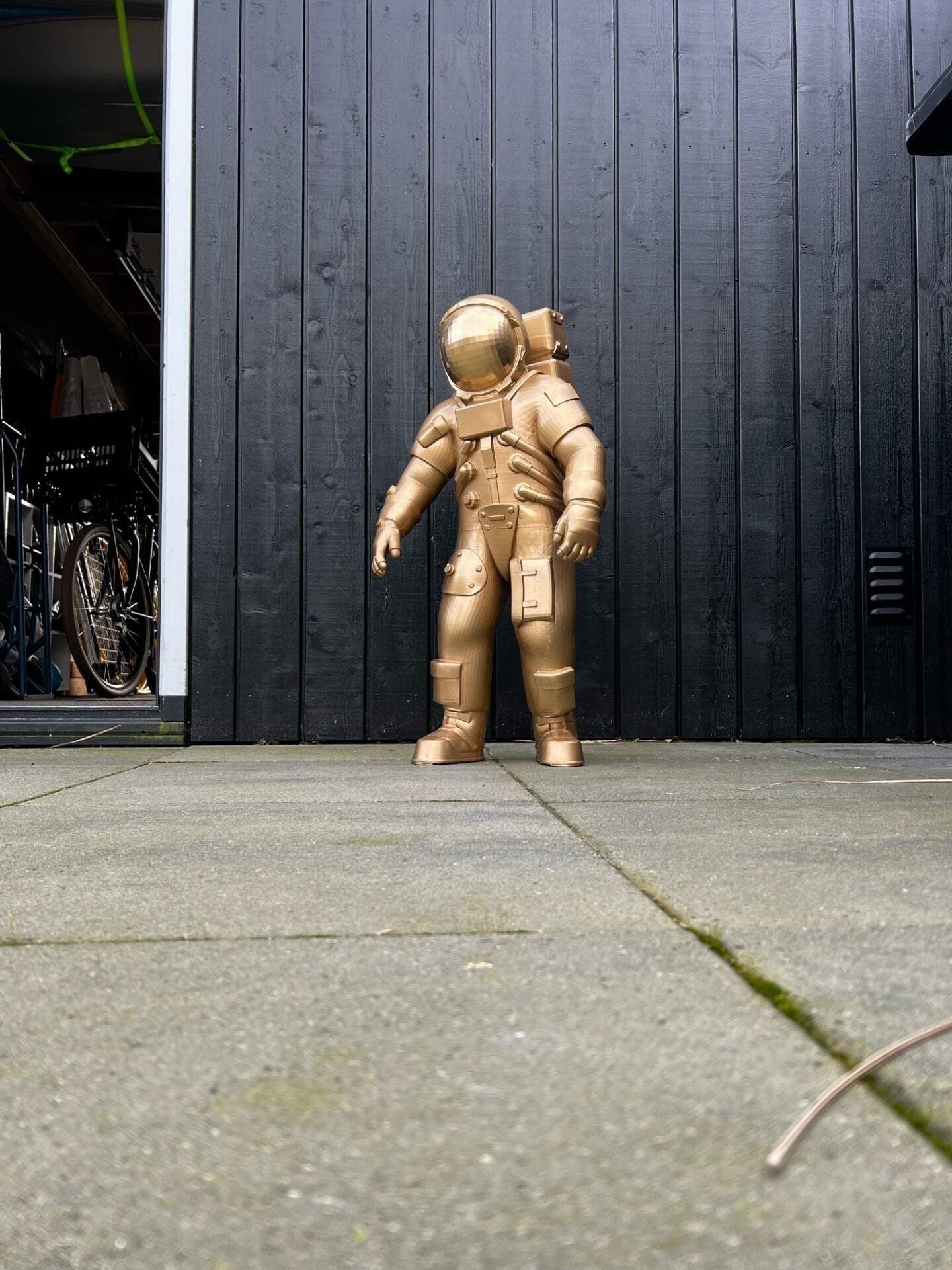 gold astronaut statue nasa