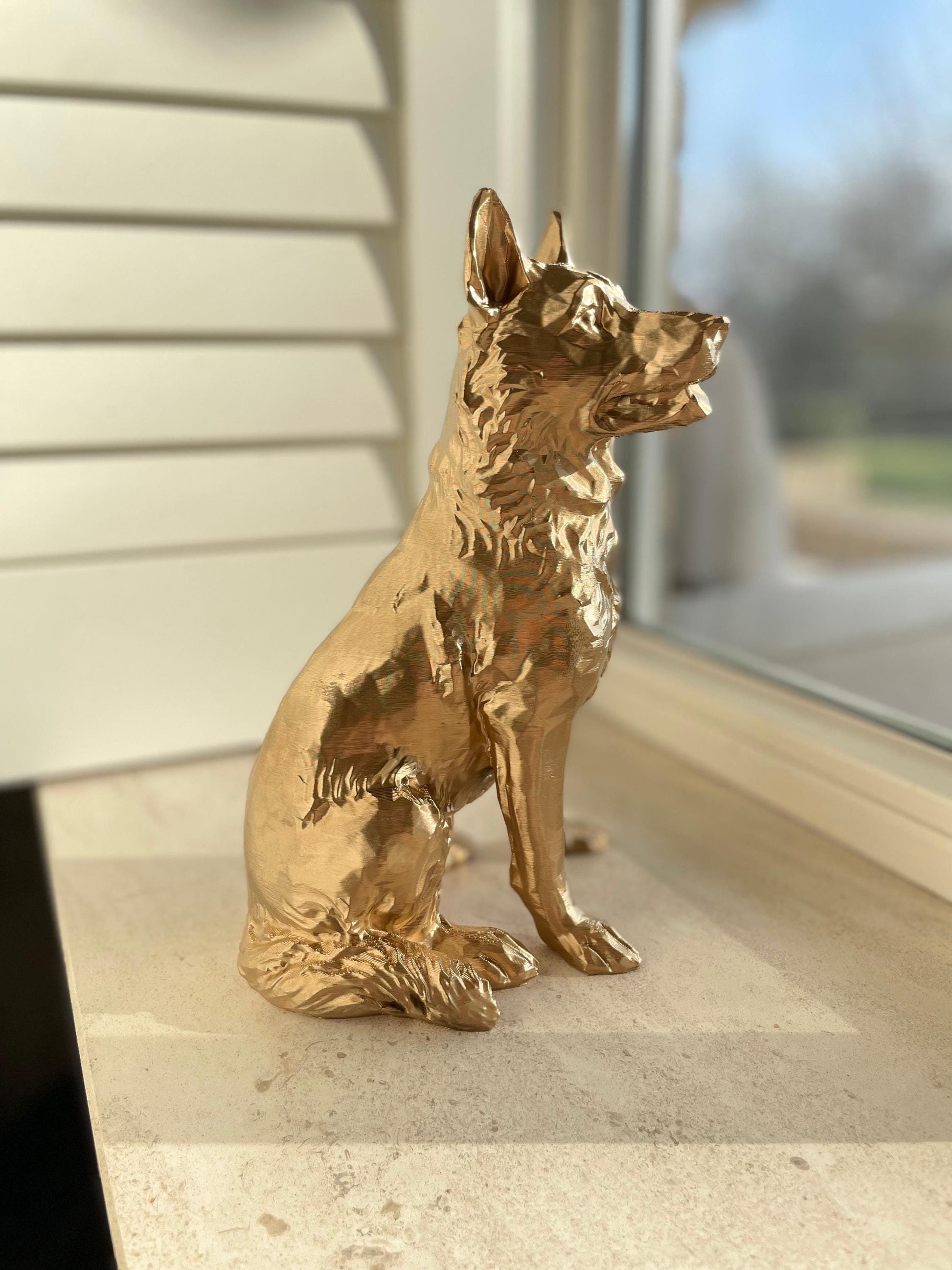 German shepherd golden statue