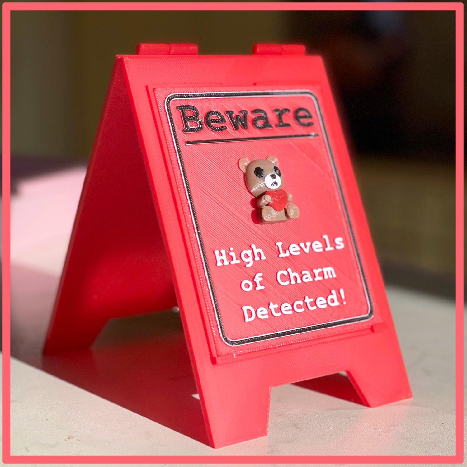 Funny Desk Sign Red A Frame – “Beware High Levels of Charm” Perfect Quirky Gift & Cute Novelty Tabletop Decor!